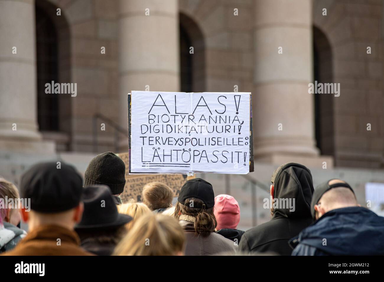 Demonstration against coronavirus vaccinations in front of Parliament House in Helsinki, Finland Stock Photo