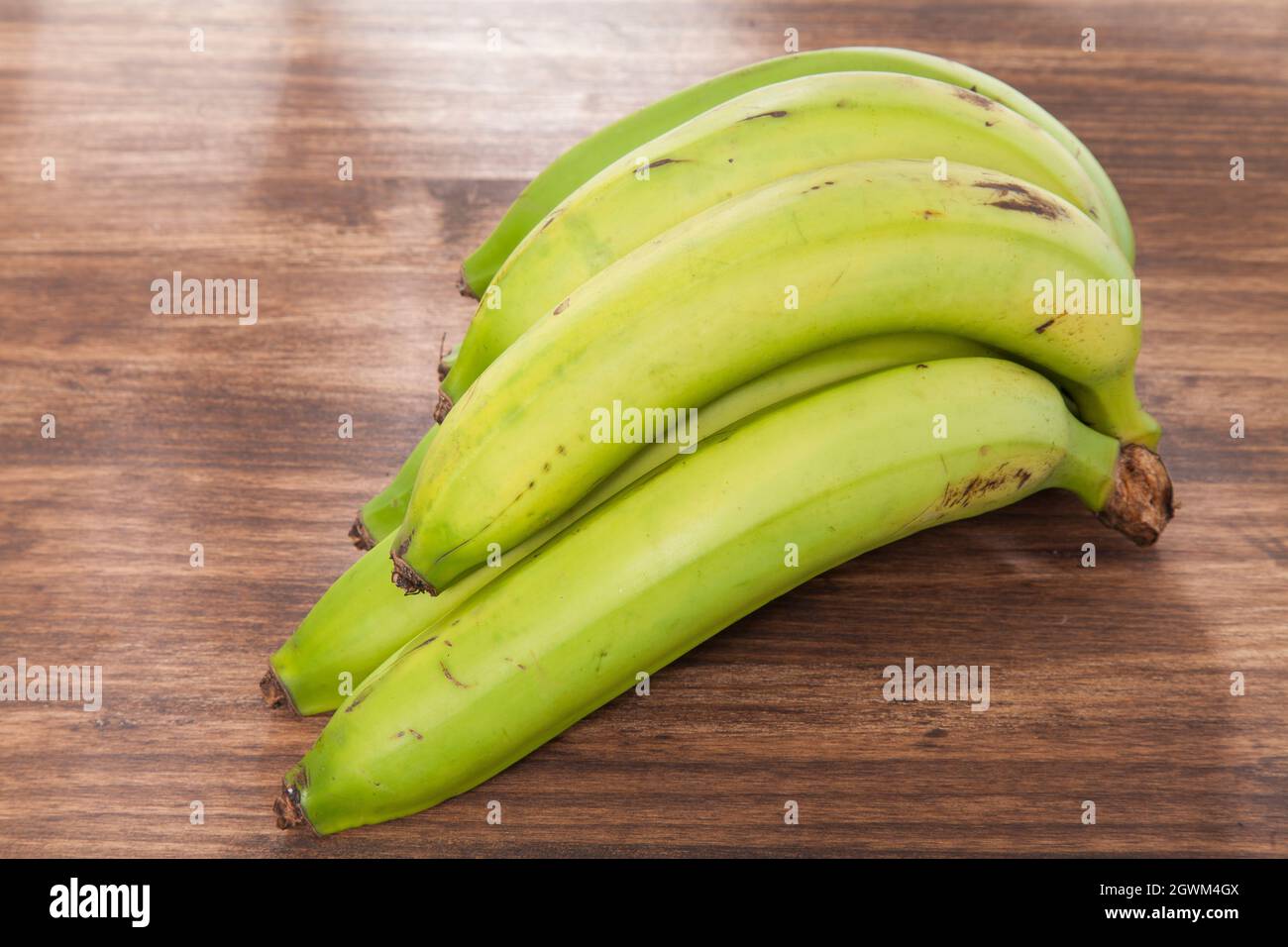 Organic Green Banana Delicious Tropical Fruit - Musa Paradisiaca Stock Photo