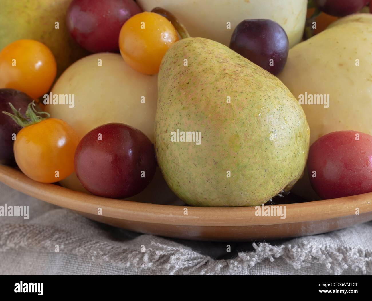 Still life: fruit in a ceramic plate Stock Photo