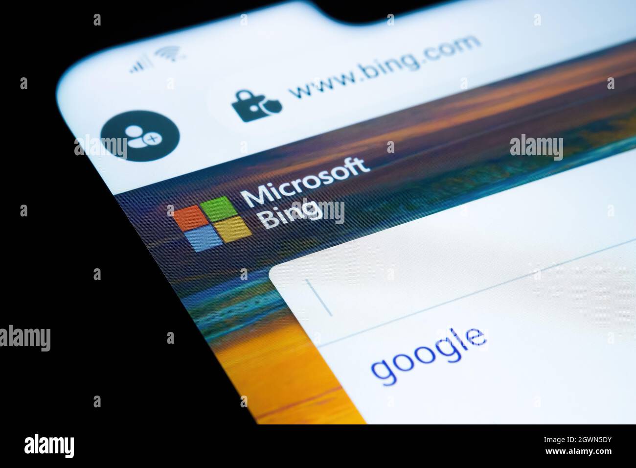 Microsoft BING search engine website with typed GOOGLE word seen on smartphone screen. Concept for competition. Selective focus. Stafford, United King Stock Photo