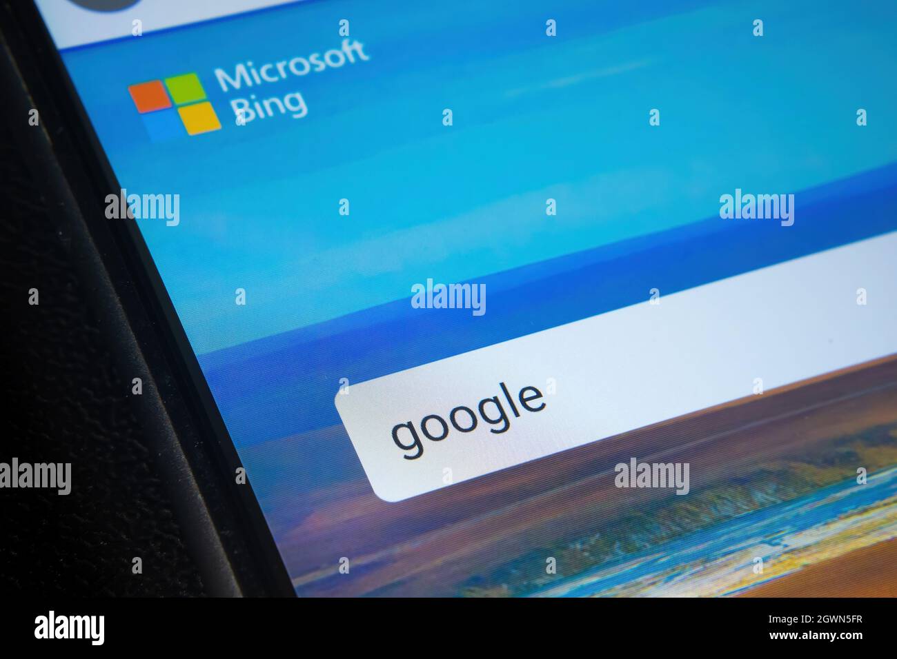 Microsoft BING search engine website with typed GOOGLE word seen on smartphone screen. Concept for competition. Selective focus. Stafford, United King Stock Photo