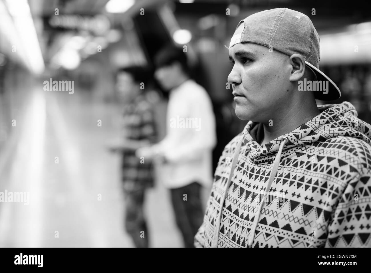 Man Wearing Cap Looking Away At Subway Station Stock Photo Alamy