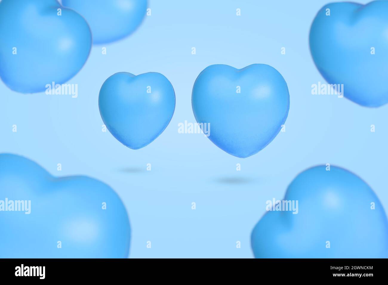 Creative idea with many floating hearts in the air on pastel blue ...