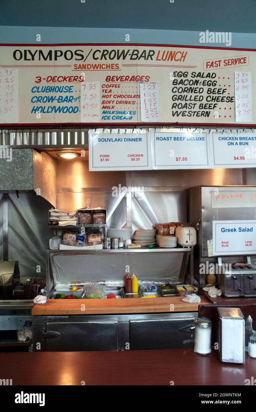The interior amd menu sign above the kitchen at a retro greasy spoon diner and restaurant in Toronto, Ontario, Canada. Stock Photo