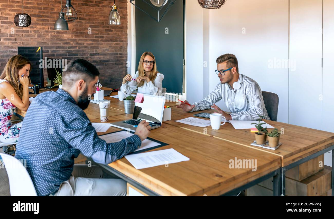 Group Of People Working On Table Stock Photo