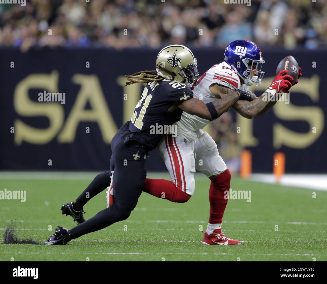 New Orleans, United States. 03rd Oct, 2021. New York Giants tight end Evan Engram (88) snags a pass in front of New Orleans Saints cornerback Bradley Roby at the Caesars Superdome in New Orleans on Sunday, October 3, 2021. Photo by AJ Sisco/UPI. Credit: UPI/Alamy Live News Stock Photo