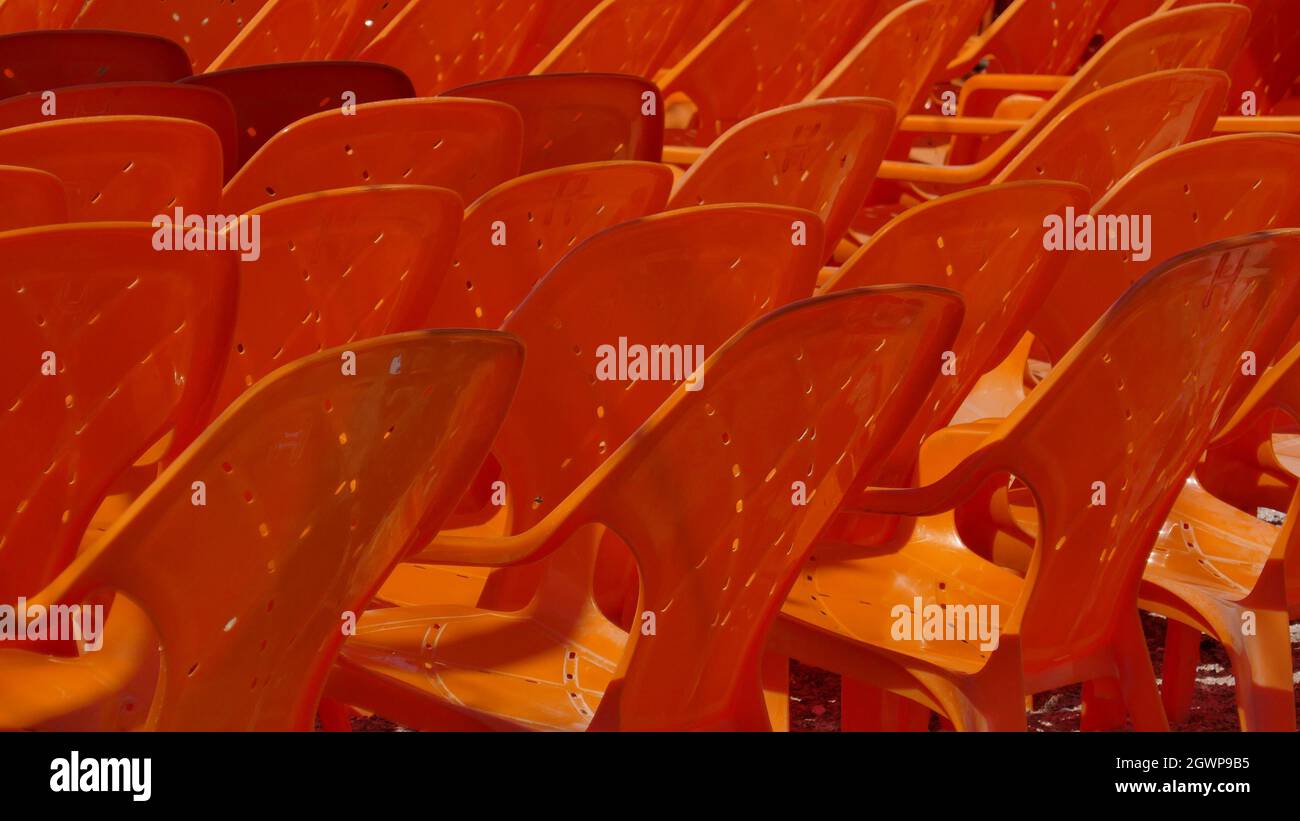 Full Frame Shot Of Red Empty Chairs Stock Photo