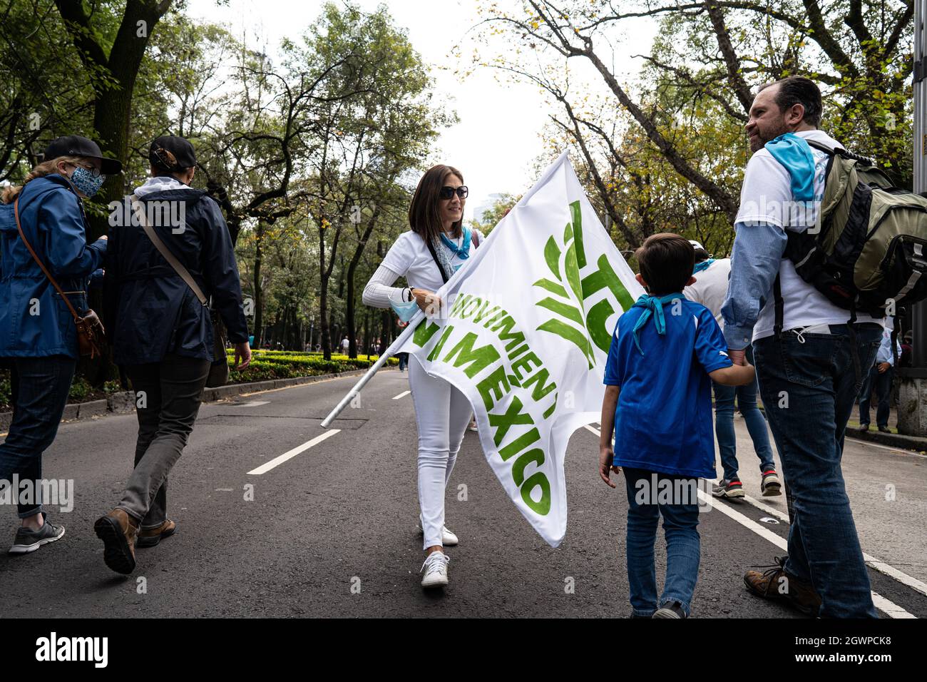 Mexico City, Mexico. 03rd Oct, 2021. A female demonstrator is seen carrying a flag during the pro-life demonstration march along the Reforma.Thousands march in Mexico City at a pro-life and pro-women demonstration march. Demonstrators came in from all over the country, with different states or organizations written on their t-shirts. The march comes after the Mexican Supreme Court ruled that abortion is no longer a crime since September 2021. Credit: SOPA Images Limited/Alamy Live News Stock Photo