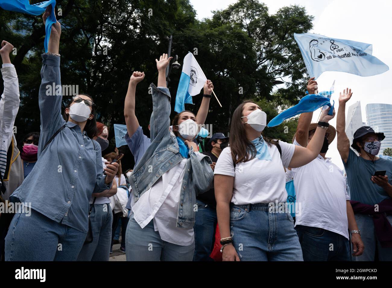 Mexico City, Mexico. 03rd Oct, 2021. Female demonstrators throw their arms in the air in response to a request from the speaker to hear from the men during the demonstration.Thousands march in Mexico City at a pro-life and pro-women demonstration march. Demonstrators came in from all over the country, with different states or organizations written on their t-shirts. The march comes after the Mexican Supreme Court ruled that abortion is no longer a crime since September 2021. Credit: SOPA Images Limited/Alamy Live News Stock Photo