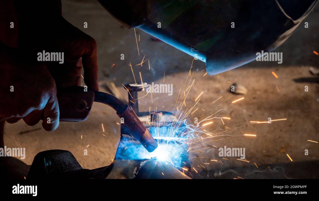 Welding Of Steel, Sparking, Not Wearing Gloves, Light Colored Like