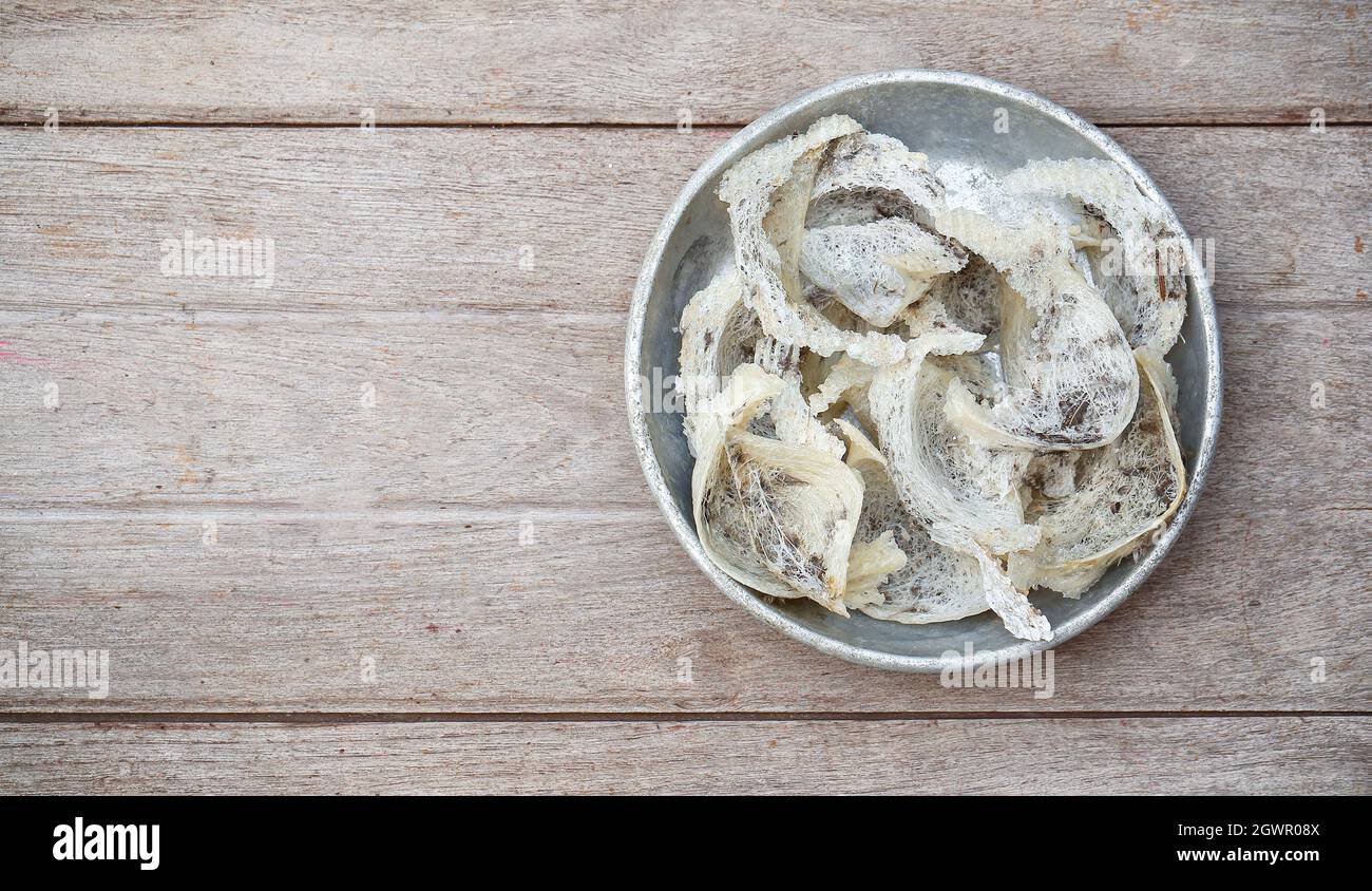 Edible Swallow Bird Nest, Isolated On Wood Plank Background Stock Photo