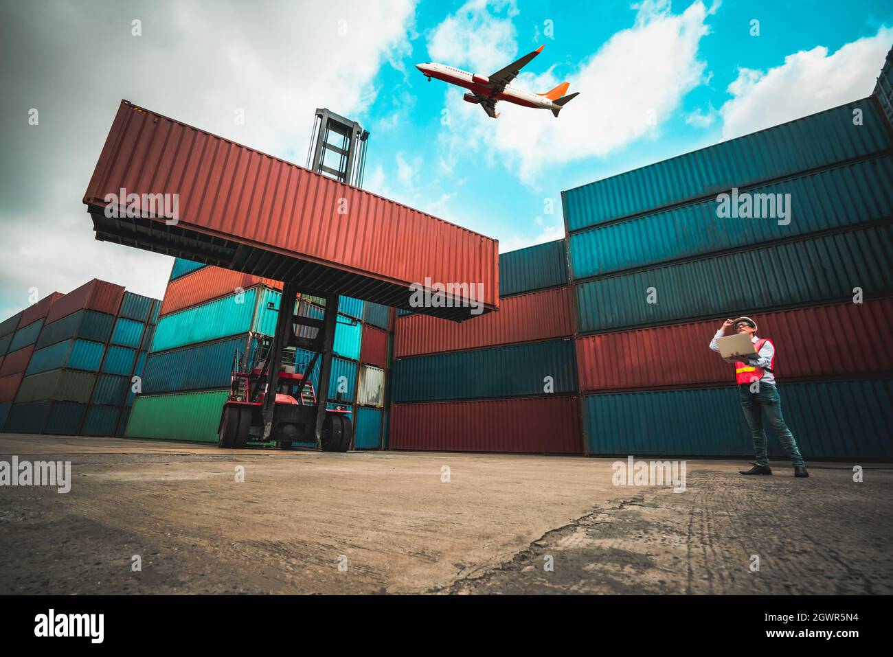 Cargo container for overseas shipping in shipyard with airplane in the