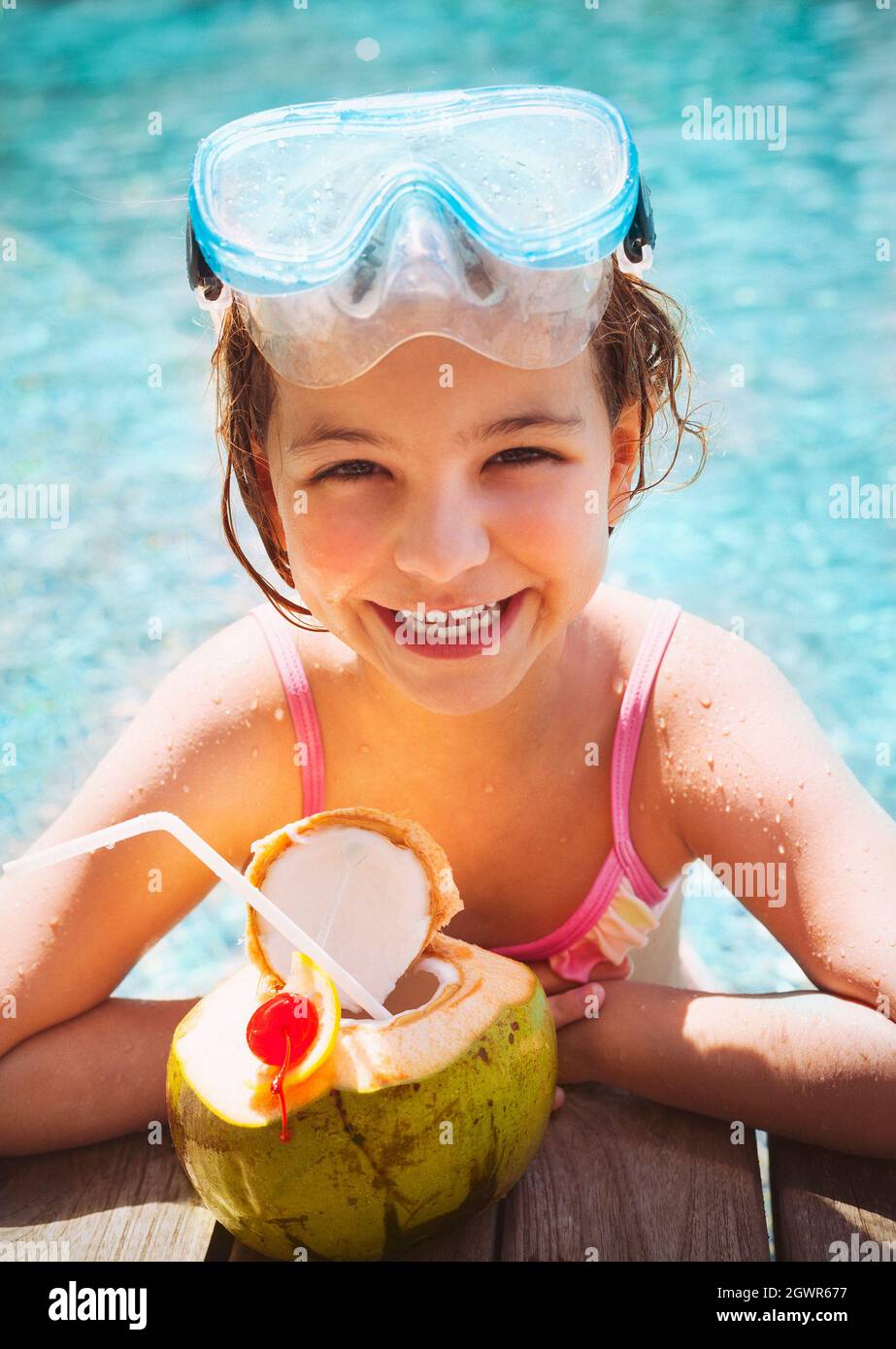 Smiling Girl Having Coconut Water At Poolside Stock Photo Alamy