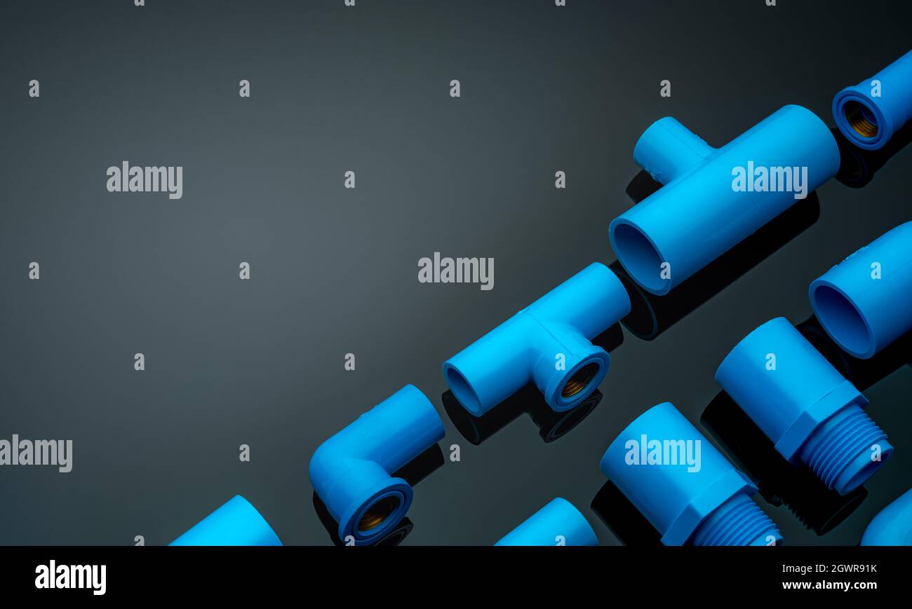 Set Of Blue Pvc Pipe Fittings Isolated On Dark Background. Blue Plastic