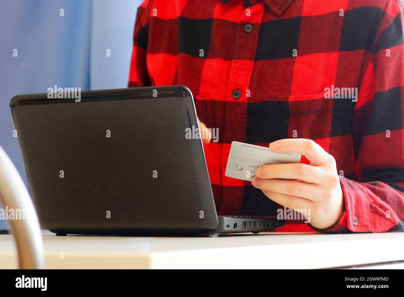 A Person Makes Purchases Using A Laptop And A Bank Credit Card. Online  Shopping Stock Photo - Alamy