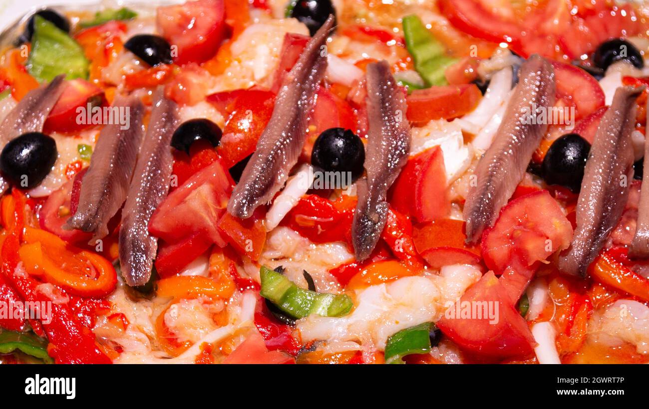 Anchovies With Black Olives In Typical Catalan Dish Esqueixada Served