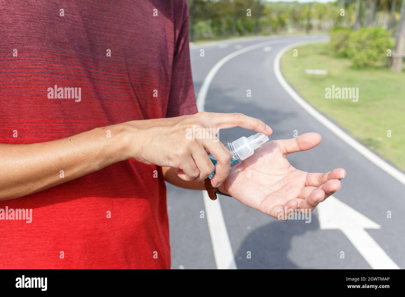 The Man Use Alcohol To Clean Hands For Prevention Of Coronavirus Virus Outbreak. Coivd 19 Stock Photo