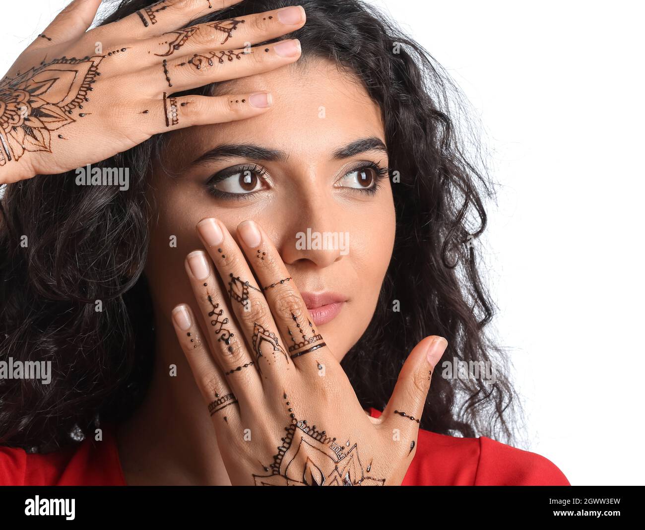 Beautiful Indian woman with henna tattoo on white background Stock