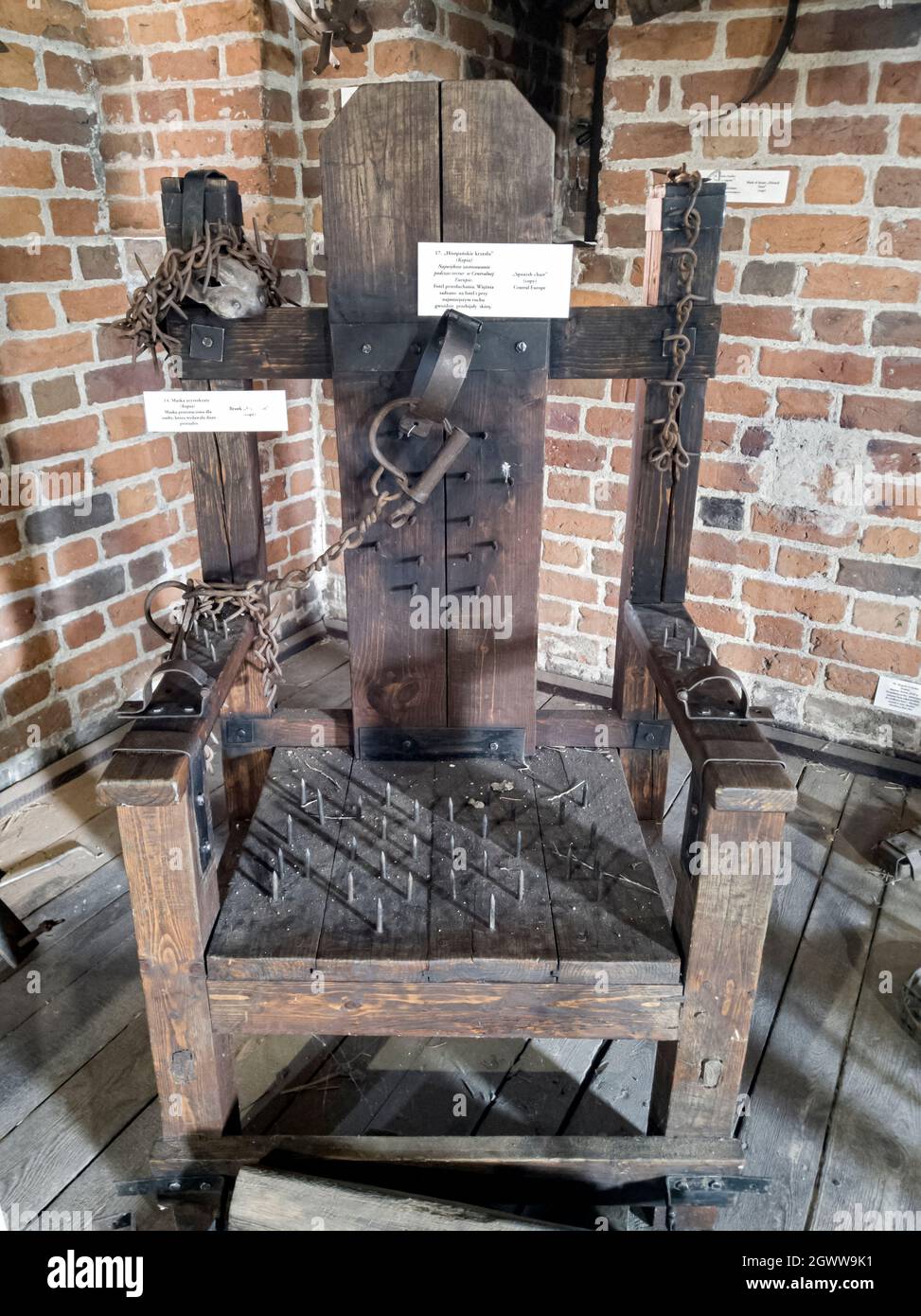 Spanish chair (instrument of torture) – interrogation chair. Every movement of a person sitting on a chair caused piercing of the skin. Stock Photo