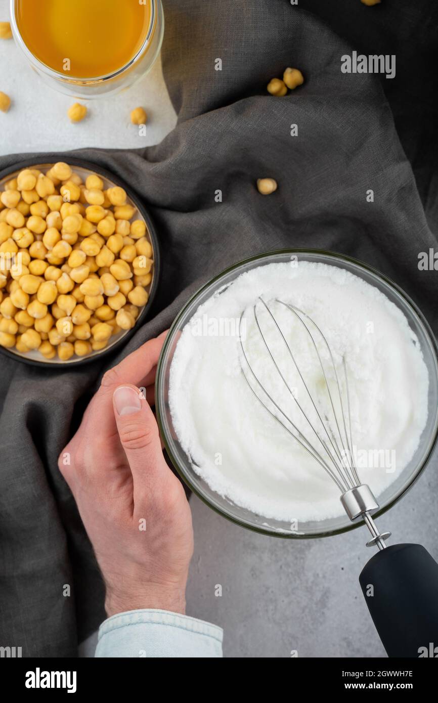 Chickpea Aquafaba Egg Replacement Vegan Men Hands Whippe Whisk Chickpeas Liquid In Glass Bowl Stock Photo Alamy
