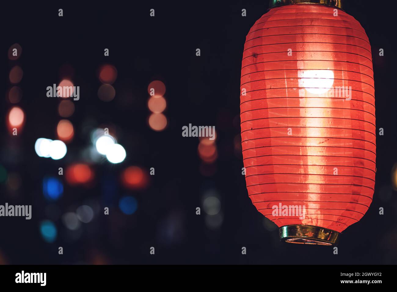 Red chinese lanterns in a row illuminated at night in Chengdu, Sichuan province, China Stock Photo