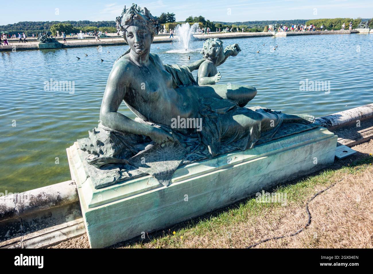 Bronze sculptures dot the landscape at the Gardens of Versailles in France Stock Photo