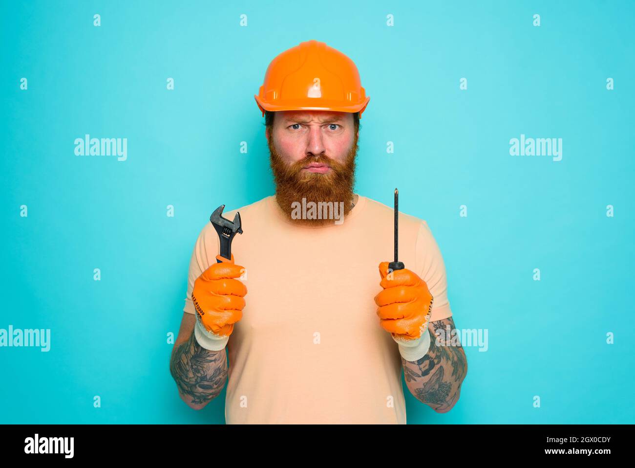 Incompetent worker is unsure and confused about his work Stock Photo