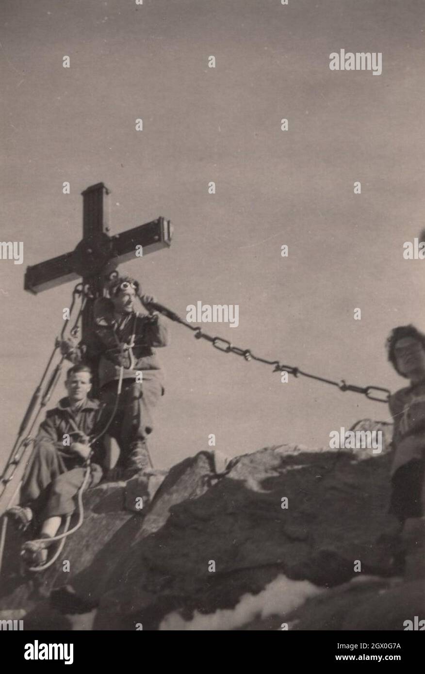 Super rare antique vintage photograph about three climbers from the 1910's. These gentlemen are heros because there are not mountain high enough for them to get over it and stand a  Christian Cross to show the world to we reached and occupied this peak. The Mountain was fallen in this battle. Source : Original photograph Stock Photo