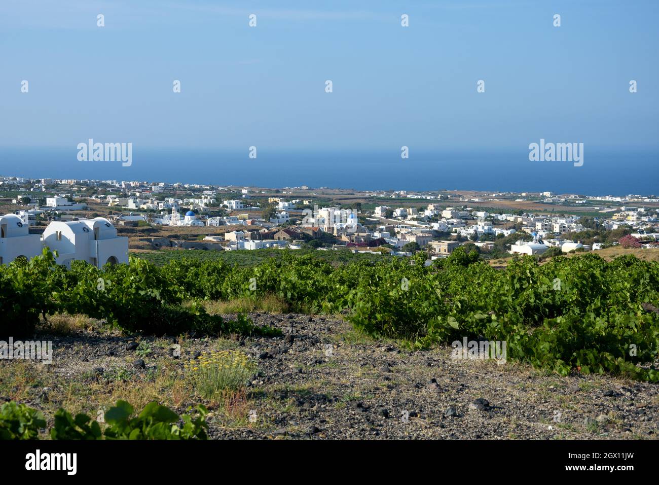 View over the vineyards and traditional villages in Santorini, Greece, known for its famous wine Vinsanto Stock Photo