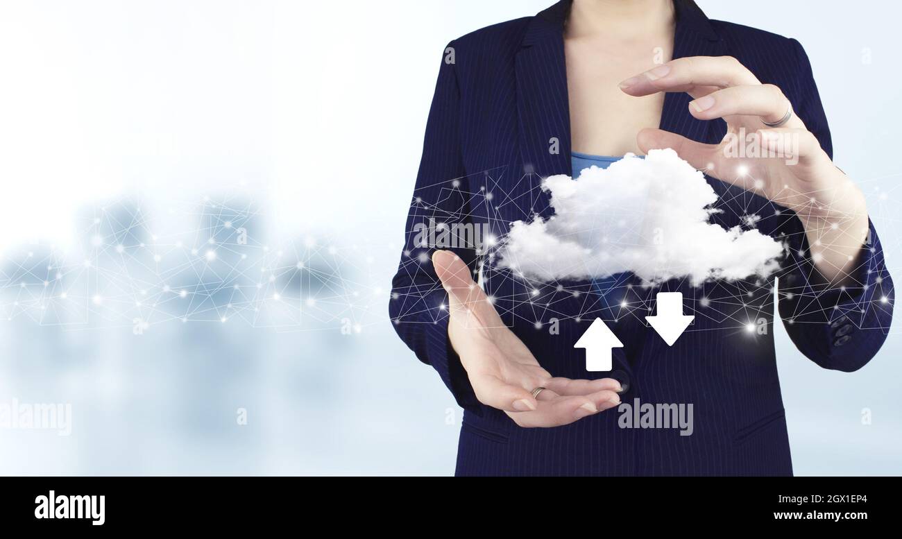 Download Data Storage Business Technology Network Concept. Two hand holding virtual holographic cloud, download, data icon with light blurred backgrou Stock Photo