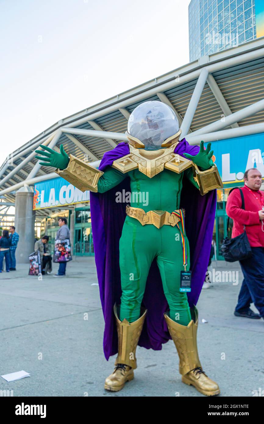 Attendee portraying Mysterio character in colorful costume, at 