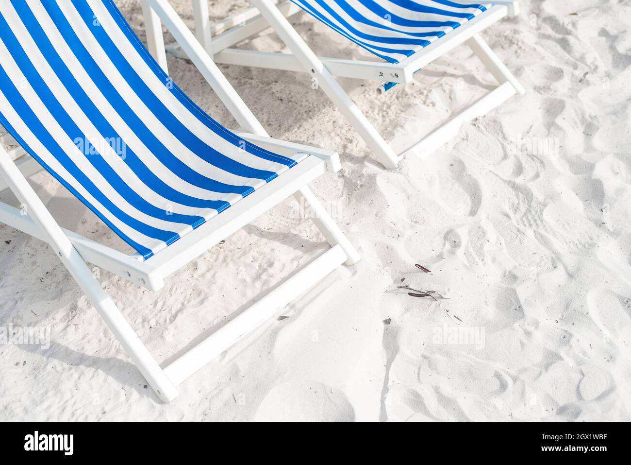 High Angle View Of Empty Deck Chairs At Beach Stock Photo