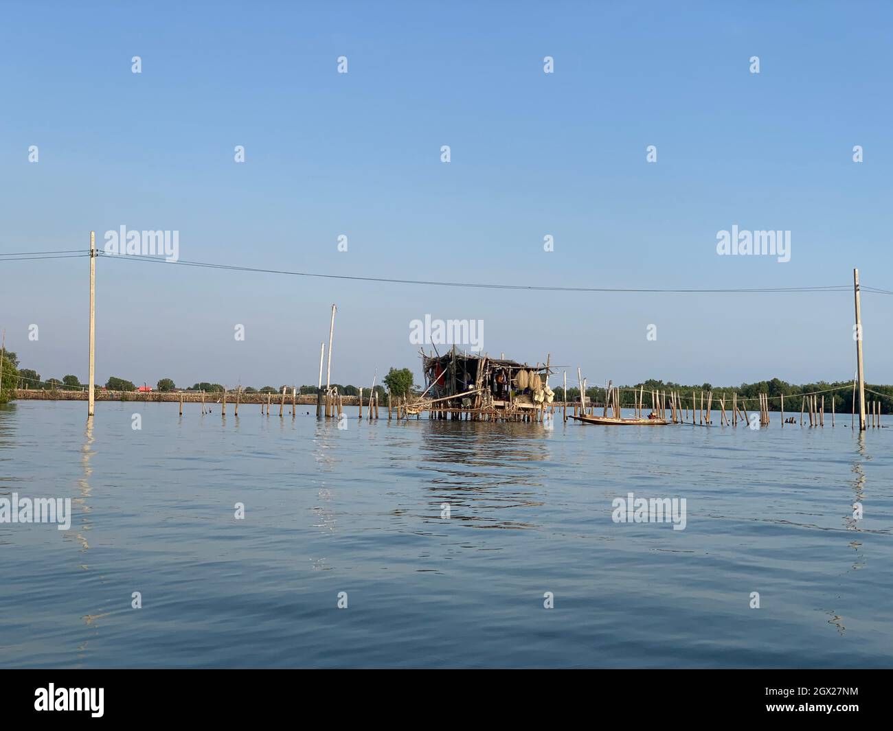 Scenic View Of Lake Against Clear Blue Sky Stock Photo
