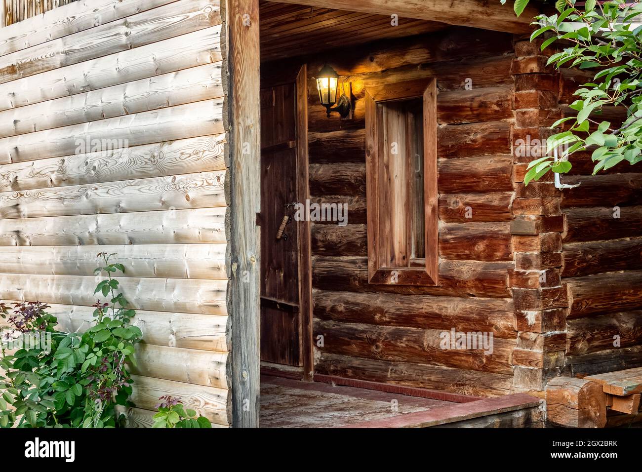 An old Russian wooden bathhouse in the backyard. Stock Photo