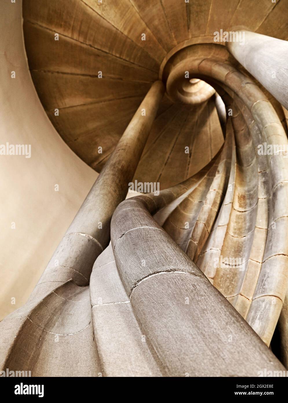 Low Angle View Of Stone Spiral Staircase Stock Photo
