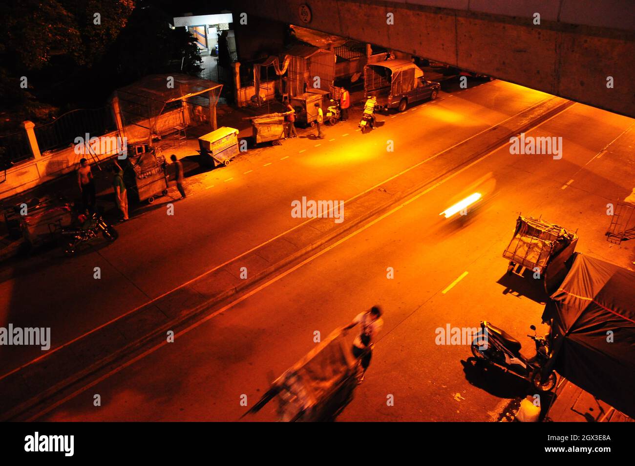 High Angle View Of People Working On Road At Night Stock Photo
