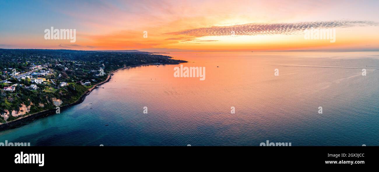 Wide Aerial Panorama Of  Sunset Glowing Over  Waters  Of Mornington Peninsula, Victoria, Australia Stock Photo