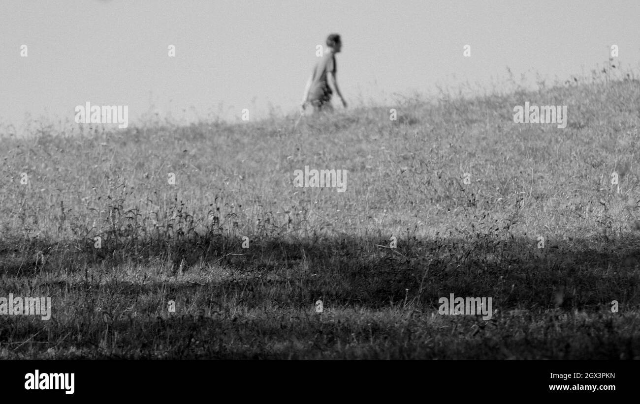 Man Walking Side View Sunlight Black and White Stock Photos & Images ...