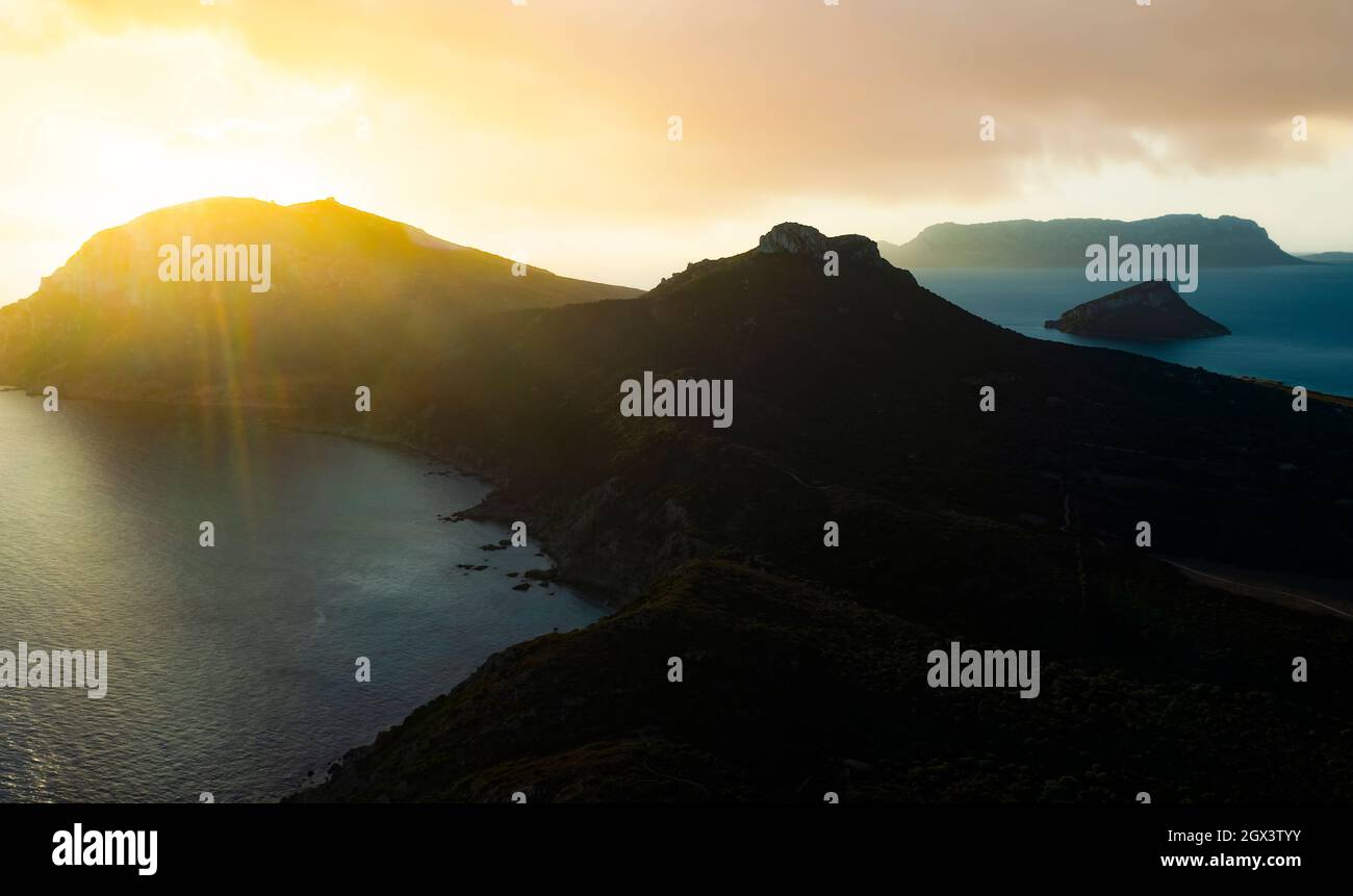 View from above, stunning aerial view of the Golfo Aranci Promontory during a stunning sunrise. Stock Photo