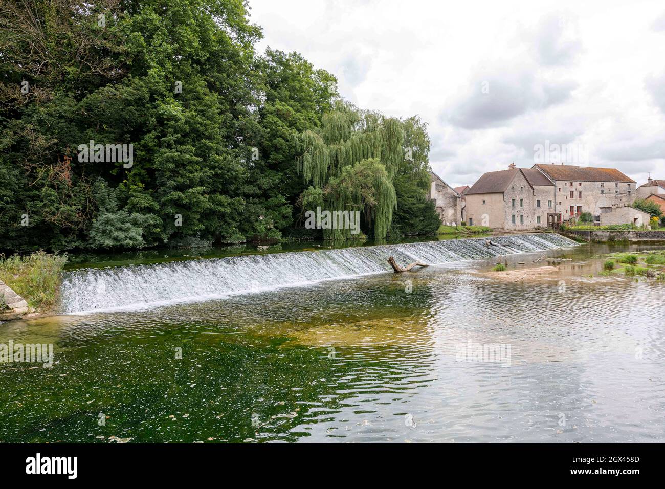 A weir on the River Tille in Lux, Cote-d'Or, France. Stock Photo