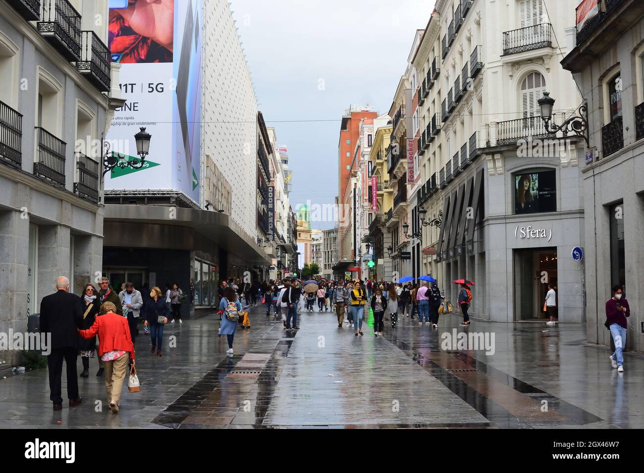 Madrid, Spain. October 3, 2021. Preciados street, people walking a rain day Stock Photo