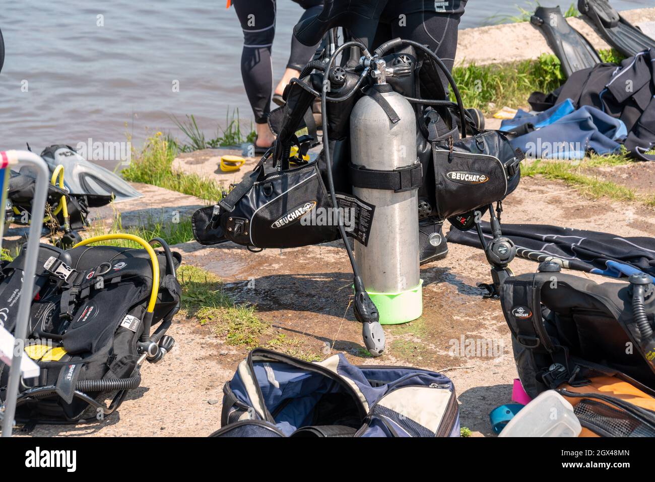 Scuba diving equipment with an oxygen tank in the center is located on