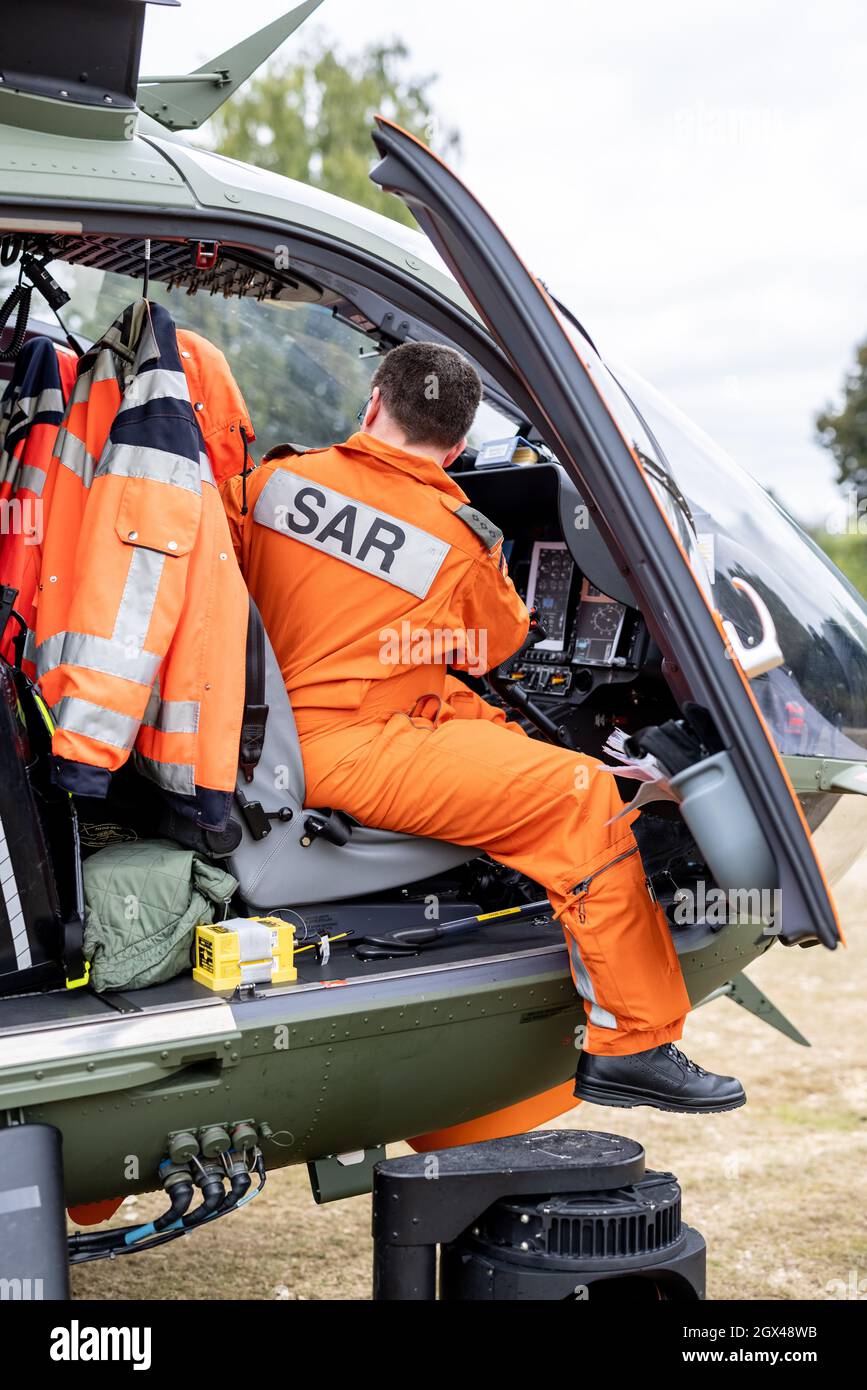 02 October 2021, North Rhine-Westphalia, Mönchengladbach: The pilot of a SAR helicopter of the type Airbus H145, sits in his cockpit during the "Meeting Day with the German Armed Forces" and 37th International Mönchengladbach Military Competition. Photo: Marcel Kusch/dpa Stock Photo