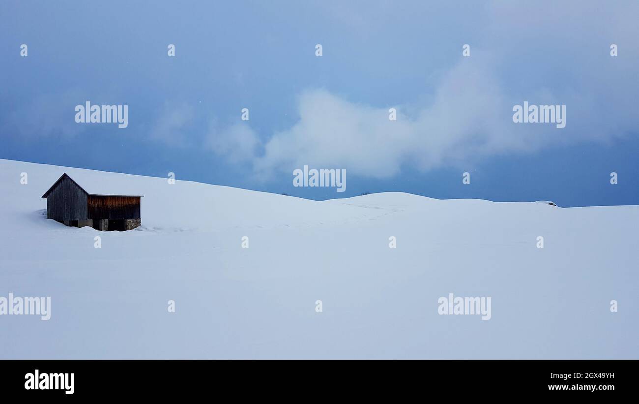 Small wooden house in a snowy mountain Stock Photo - Alamy