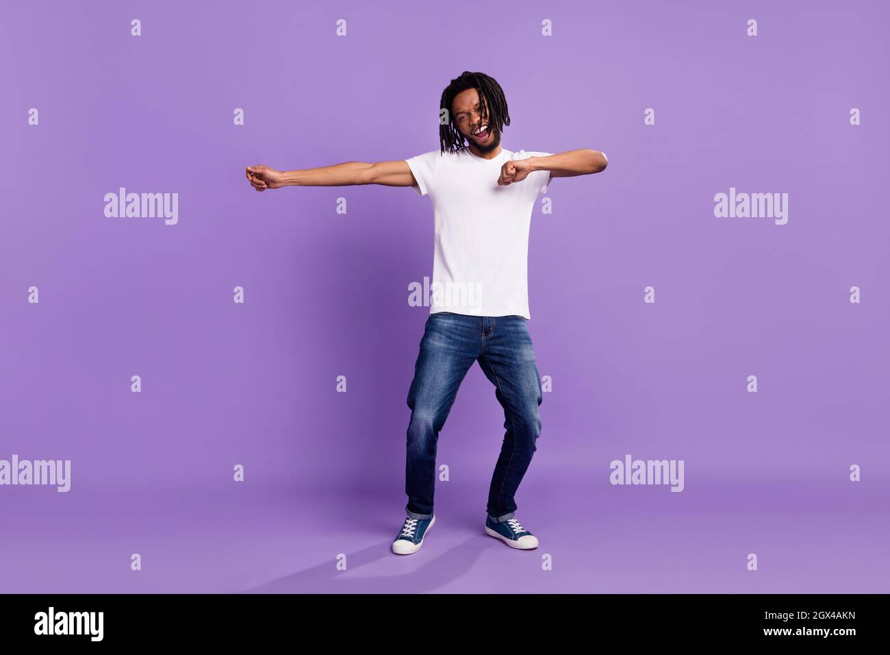 Full size photo of happy dark skin young man dance funky good mood ...