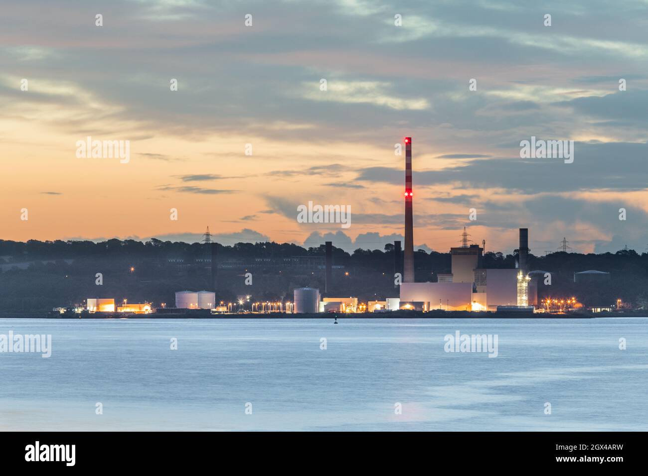 Aghada, Cork, Ireland. 04th October, 2021. Dawn begins to break over the ESB generating station in Aghada, Co. Cork, Ireland. - Picture; David Creedon / Alamy Live News Stock Photo