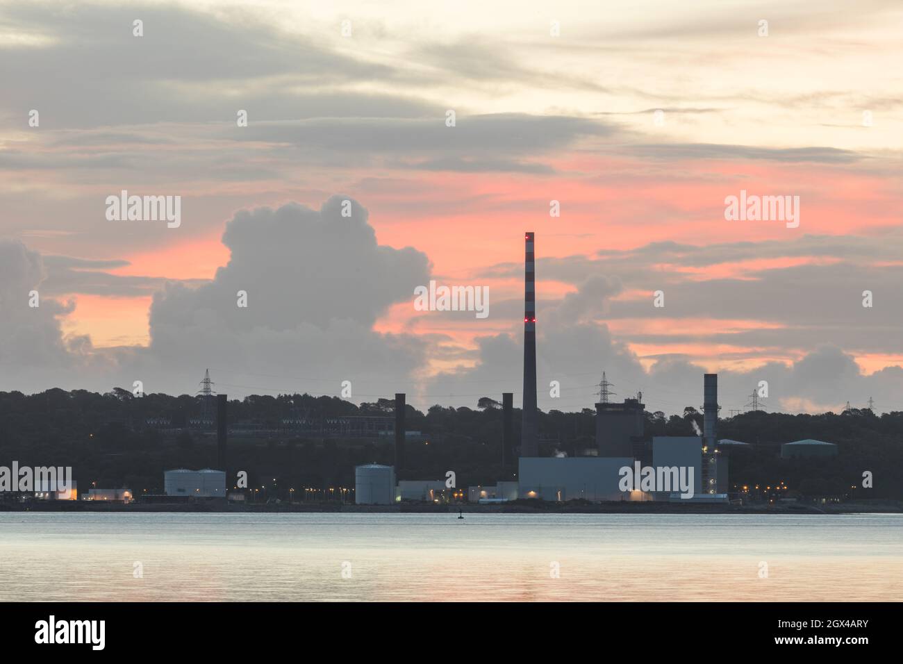 Aghada, Cork, Ireland. 04th October, 2021. Dawn begins to break over the ESB generating station in Aghada, Co. Cork, Ireland. - Picture; David Creedon / Alamy Live News Stock Photo