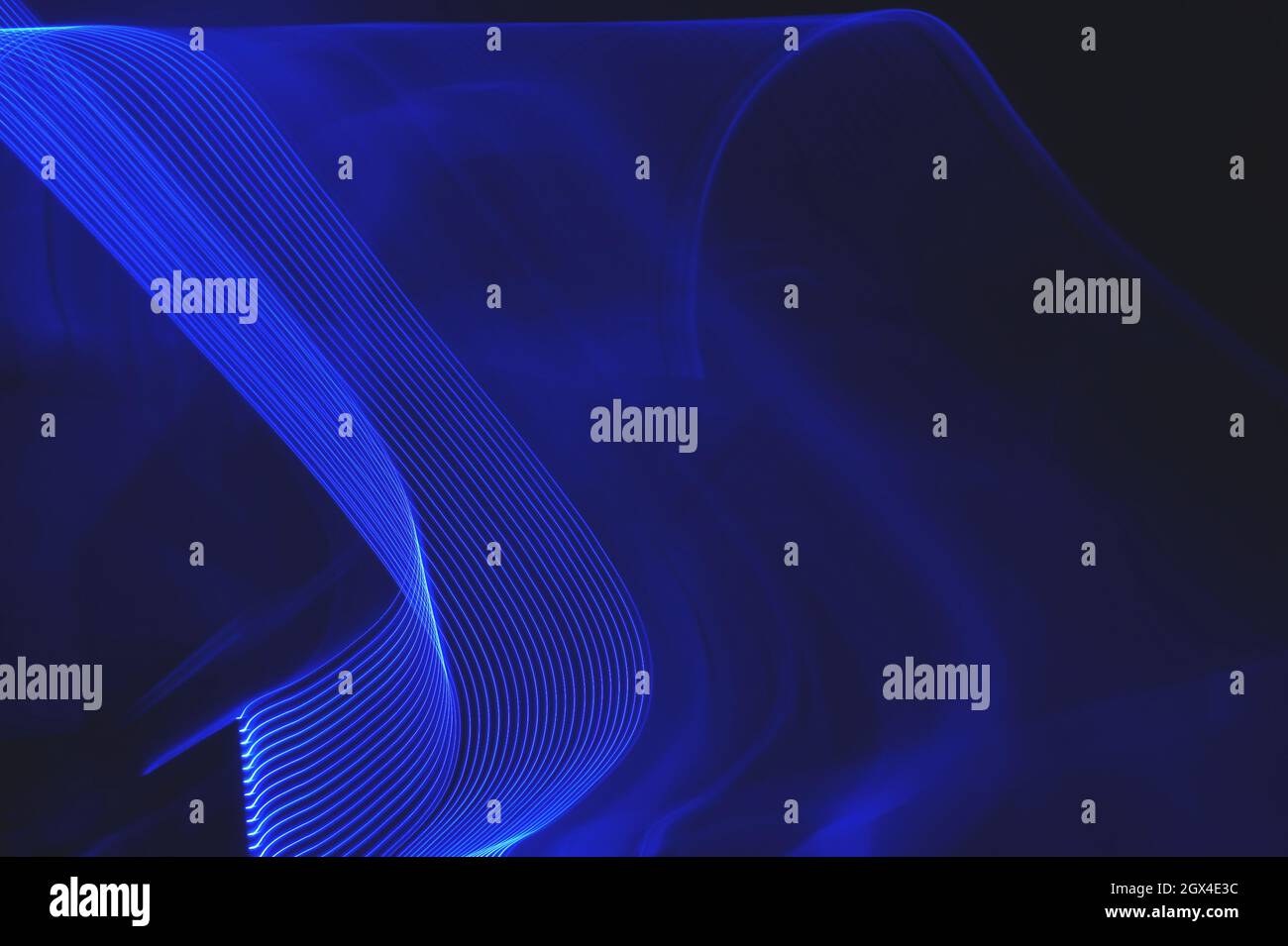 Neon blue abstract breaking wave light trail pattern Stock Photo