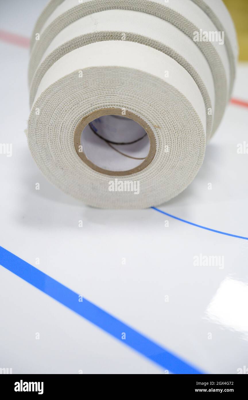 Espoo / Finland - FEBRUARY 2, 2020: Selective focus closeup of an ice hockey analytics chart with rolls of racket tape Stock Photo