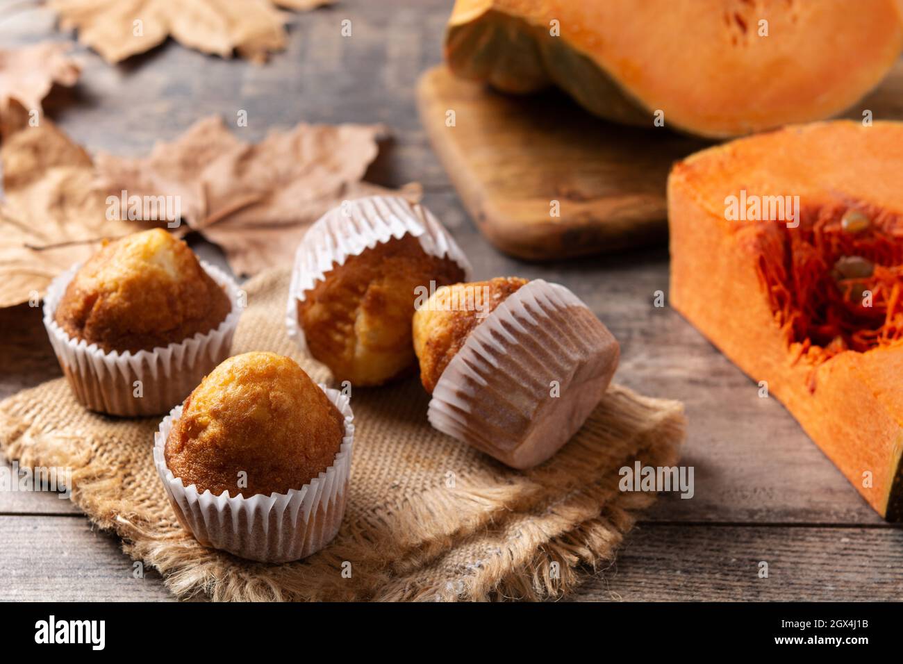 Pumpkin muffins on wooden table Stock Photo